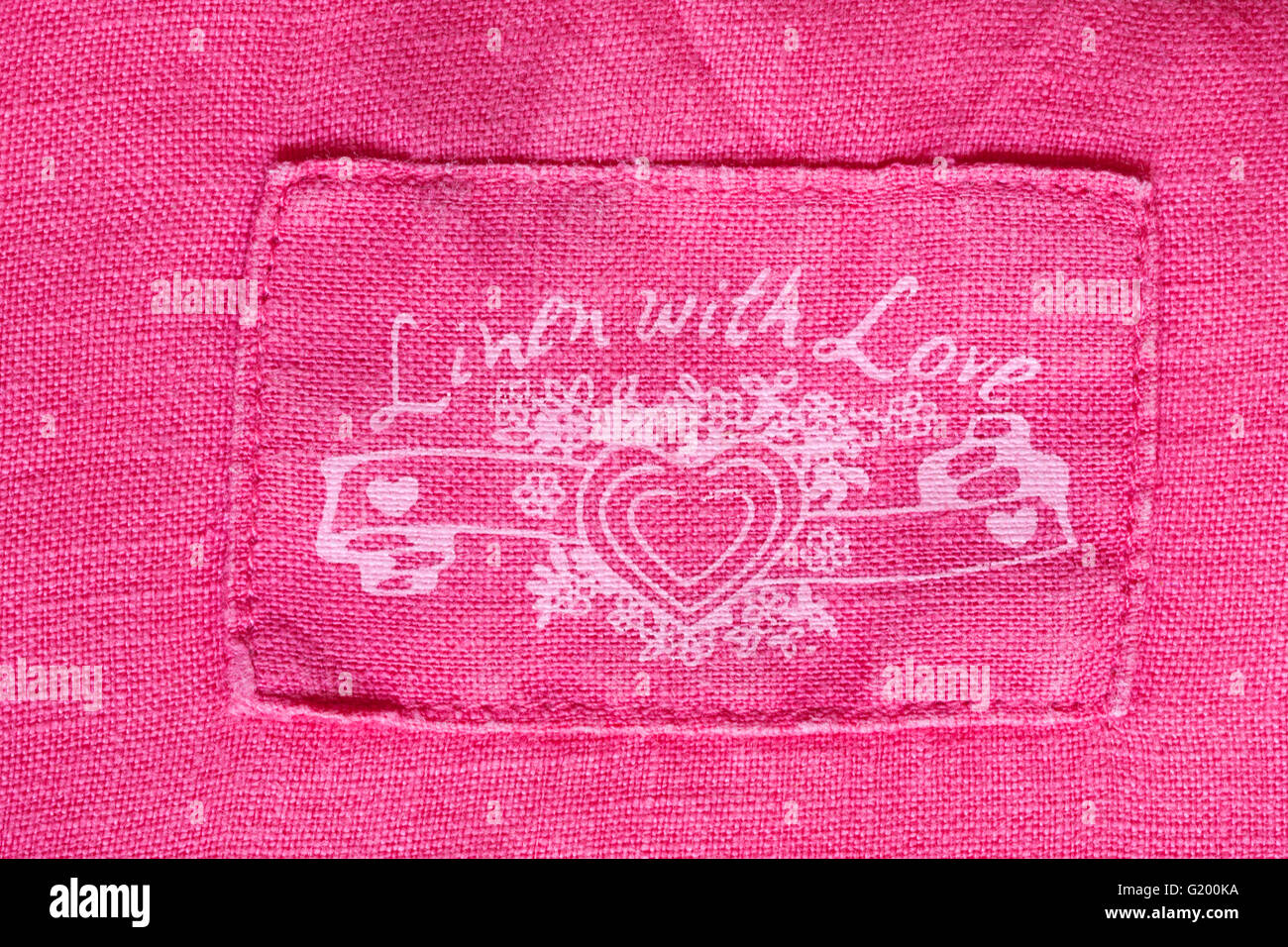 Linen with Love stamp in Marks & Spencer woman's pink blouse clothing garment Stock Photo