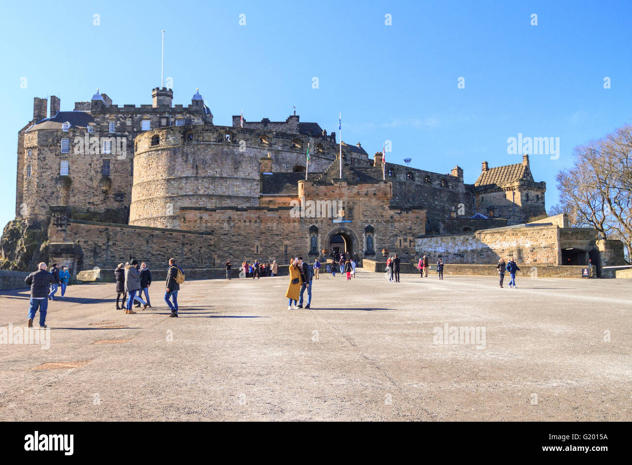 Front view of Edinburgh Castle on a bright sunny day with many tourists ...