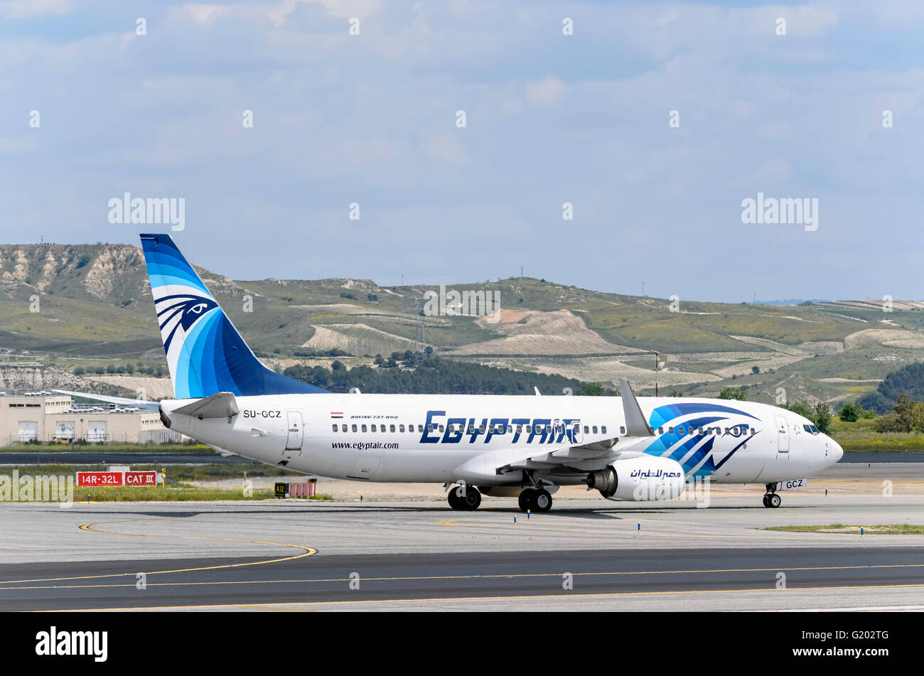 Aircraft -Boeing 737- of -Egyptair- airline, direction to airport terminal of Madrid-Barajas airport. Stock Photo