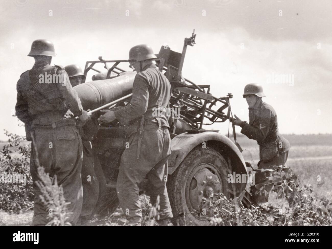 German Soldiers load a Nebelwerfer Rocket launcher in the summer 1943 on the Eastern Front Stock Photo