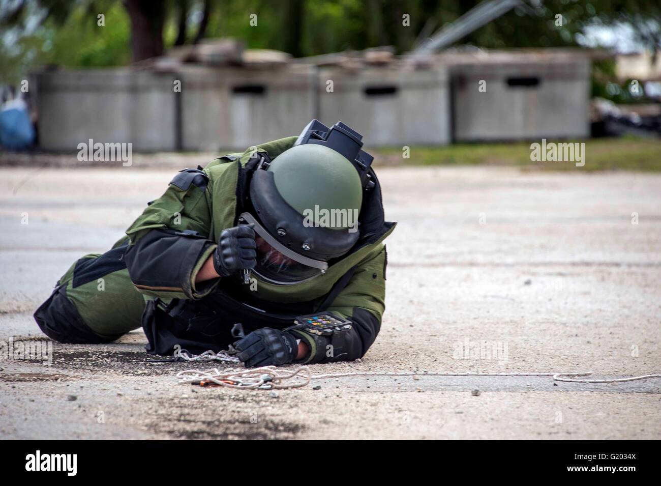 A Canadian Explosive Ordnance Disposal technician prepares to inspect an Improvised Explosive Device during a training scenario as part of Exercise Tricrab on Naval Base Guam May 18, 2016 in Guam. Tricrab is a combined exercise involving military forces from five different countries in the Asia-Pacific region. Stock Photo