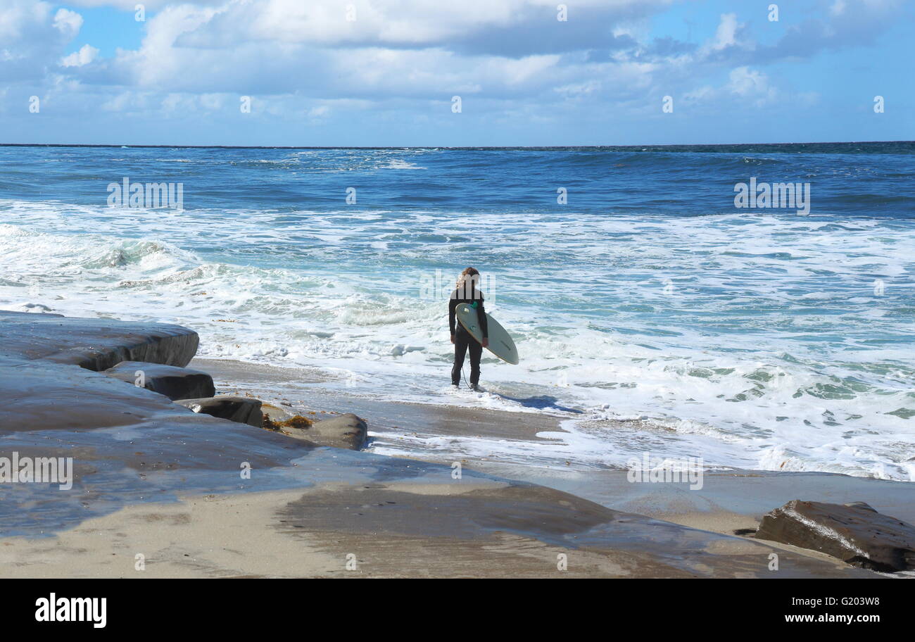 Man standing in ocean waves hi-res stock photography and images - Alamy