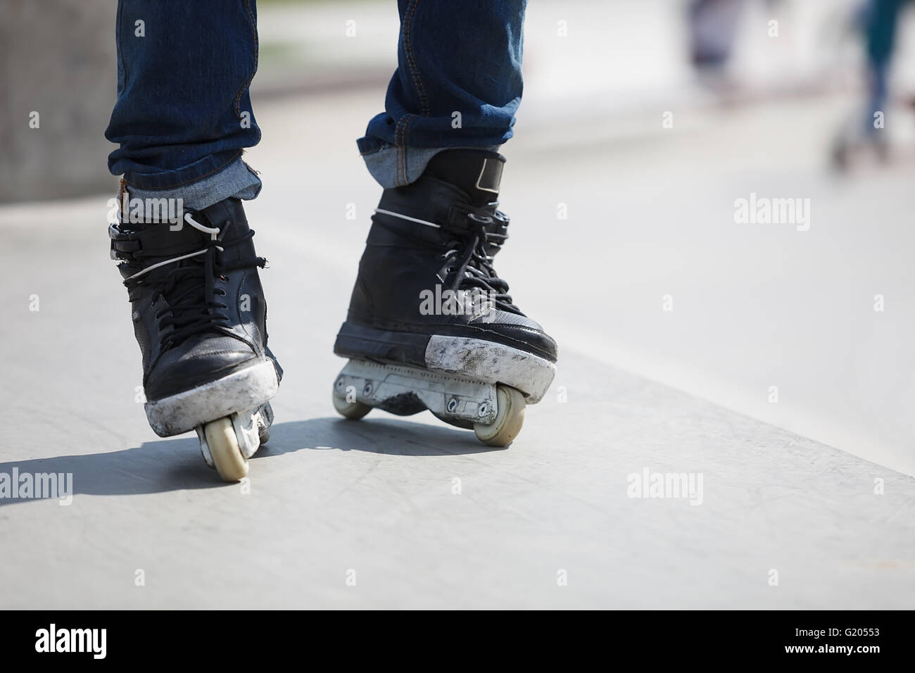 Aggressive inline skates on rollerblader feet. Extreme sports athlete