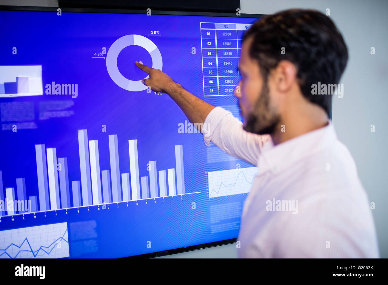 Side view of businessman using touch screen Stock Photo - Alamy