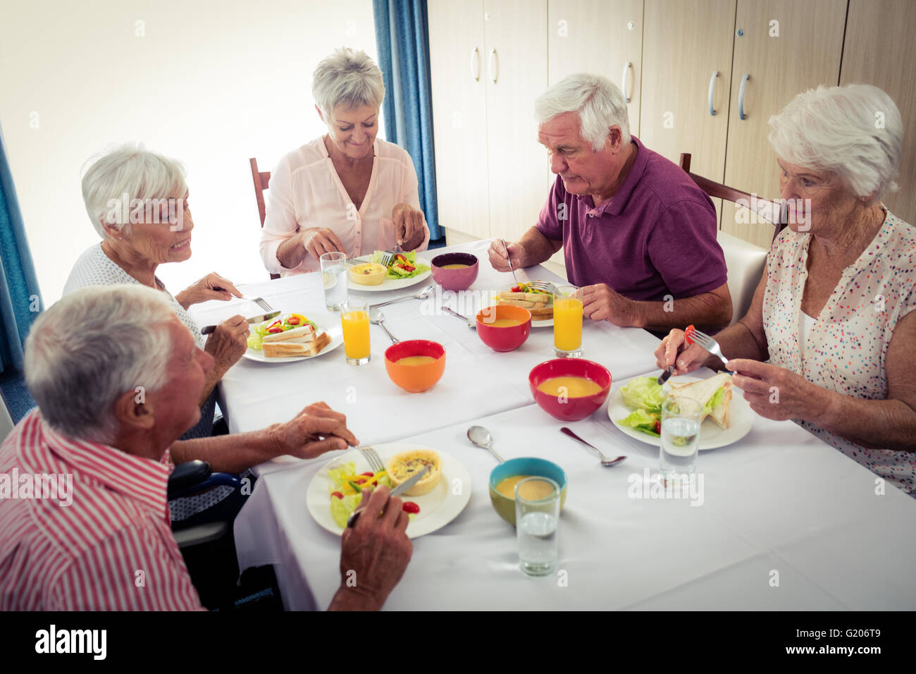 Pensioners at lunch Stock Photo