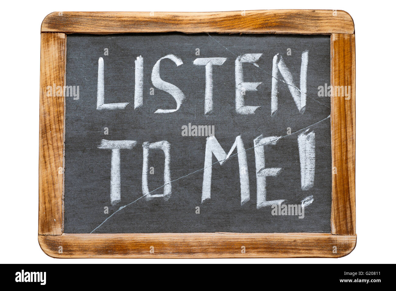 listen to me exclamation handwritten on vintage school slate board isolated on white Stock Photo