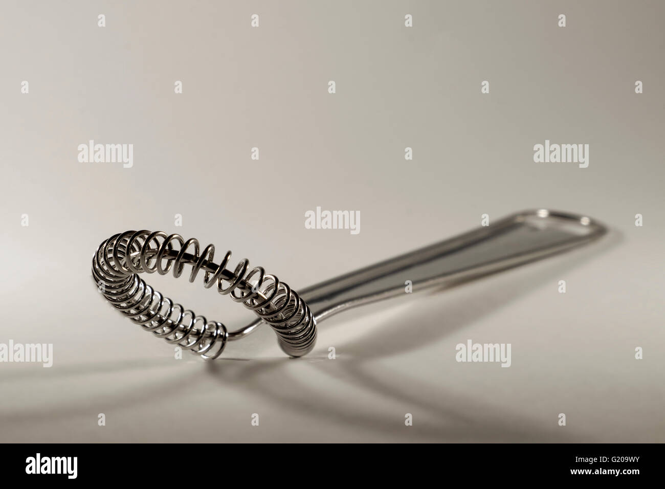 Stainless steel hand whisk isolated on white background with copy space Stock Photo