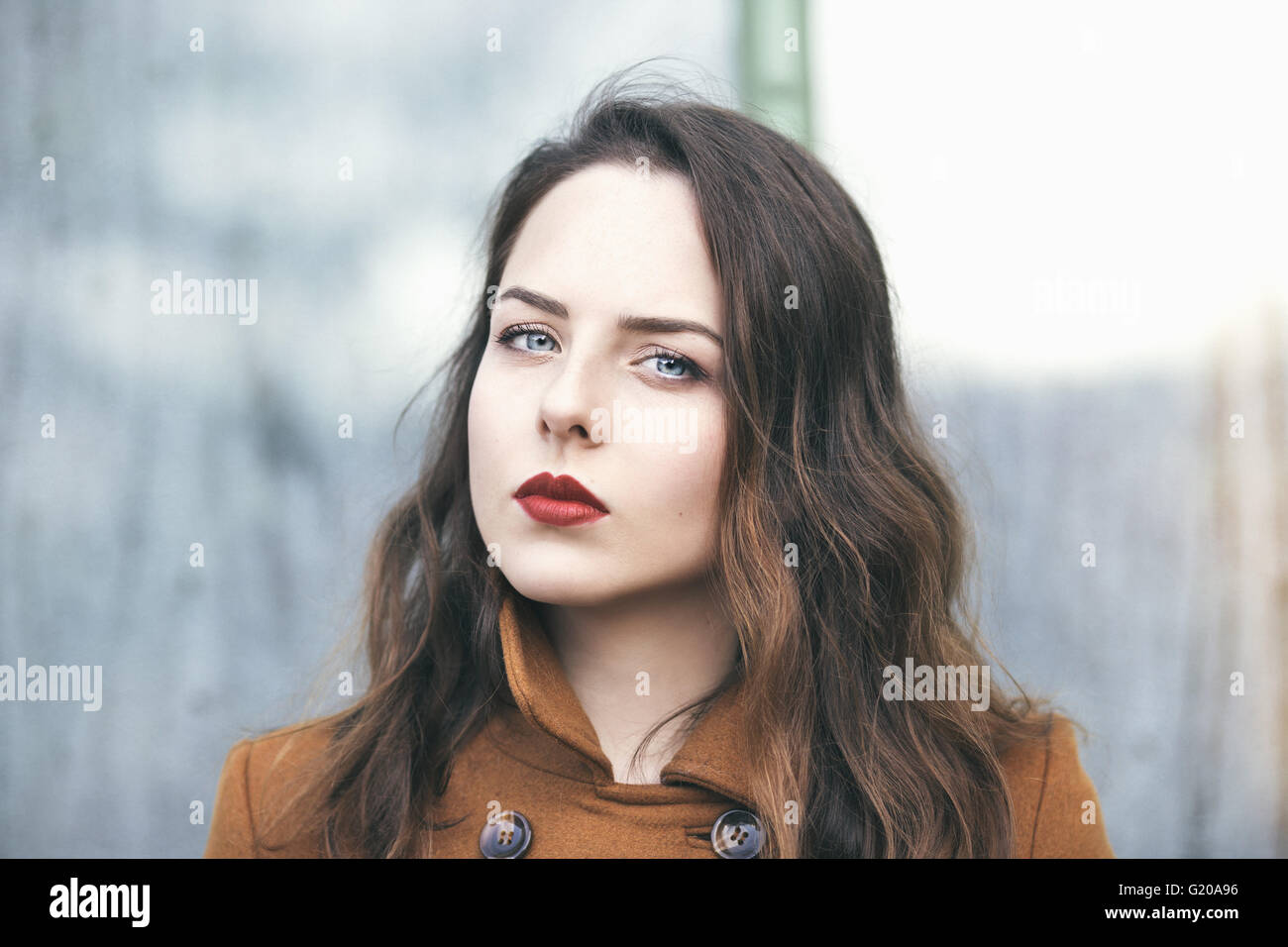 Portrait of a young beautiful woman with bright blue eyes Stock Photo ...