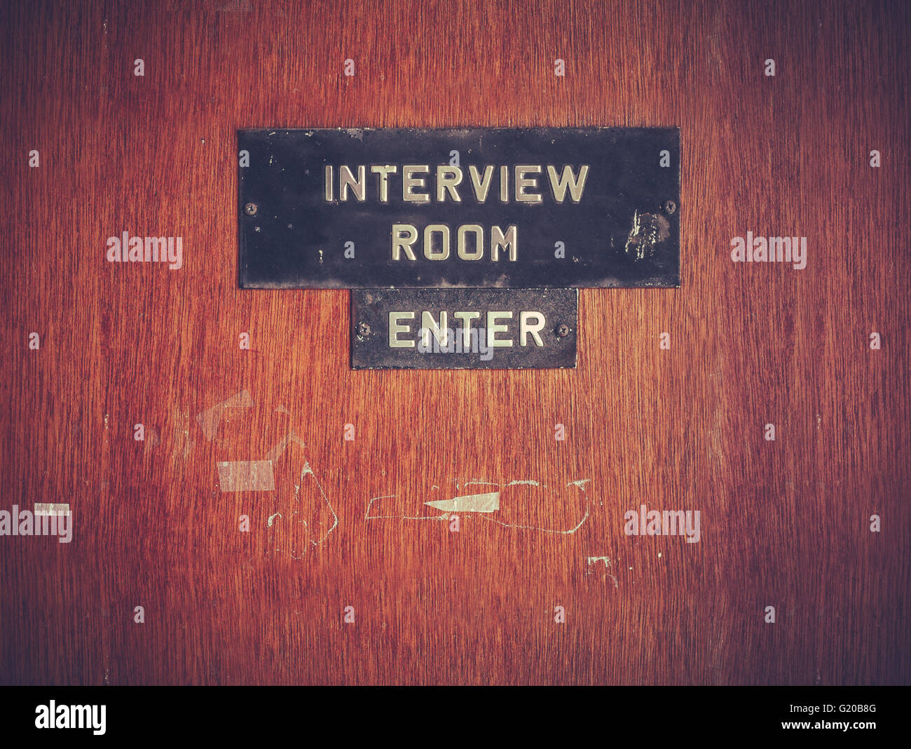 Retro Filtered Image Of A Grungy Interview Room Door Stock Photo