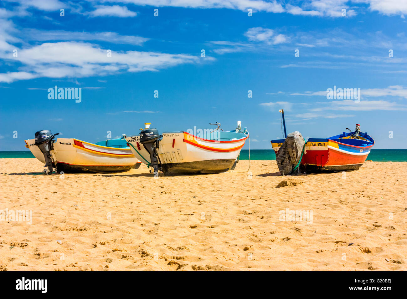 Three fishing boats in Armacao de Pera, Portugal Stock Photo