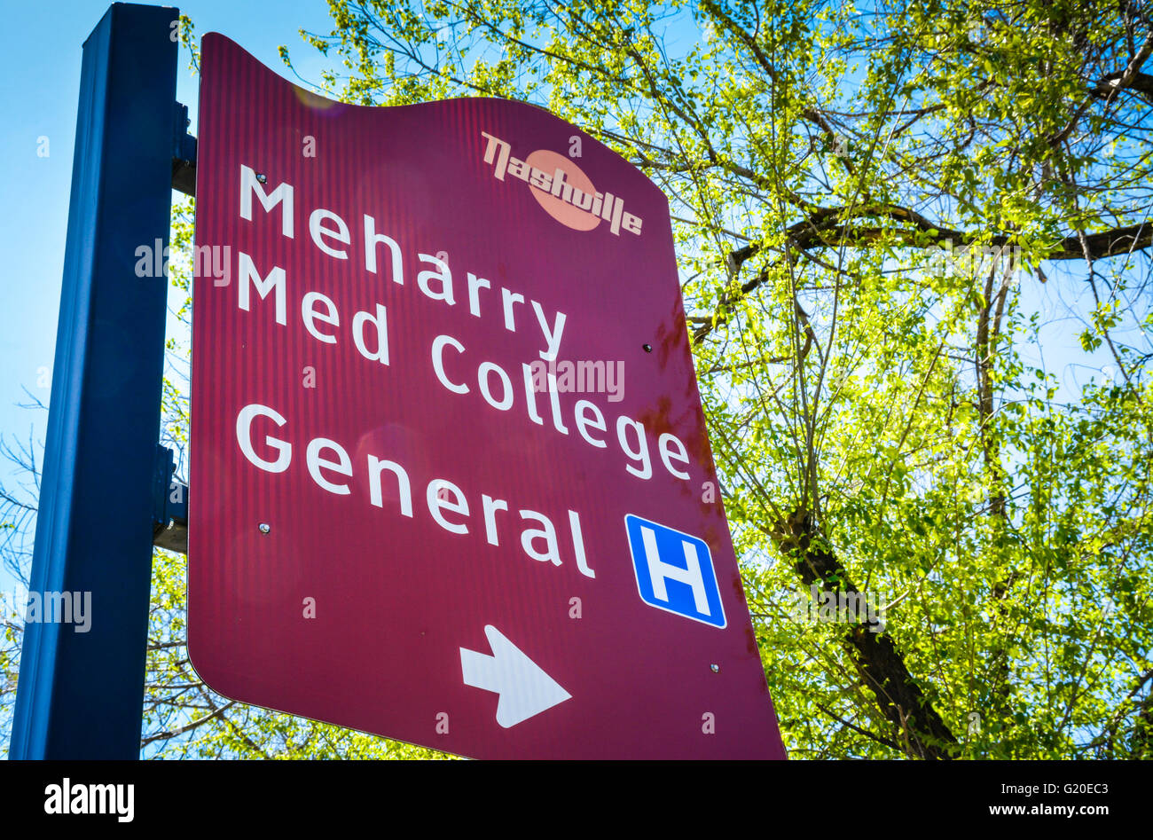 A red Nashville Street branded sign gives directions to the Meharry Medical College and the General Hospital in Nashville, TN Stock Photo