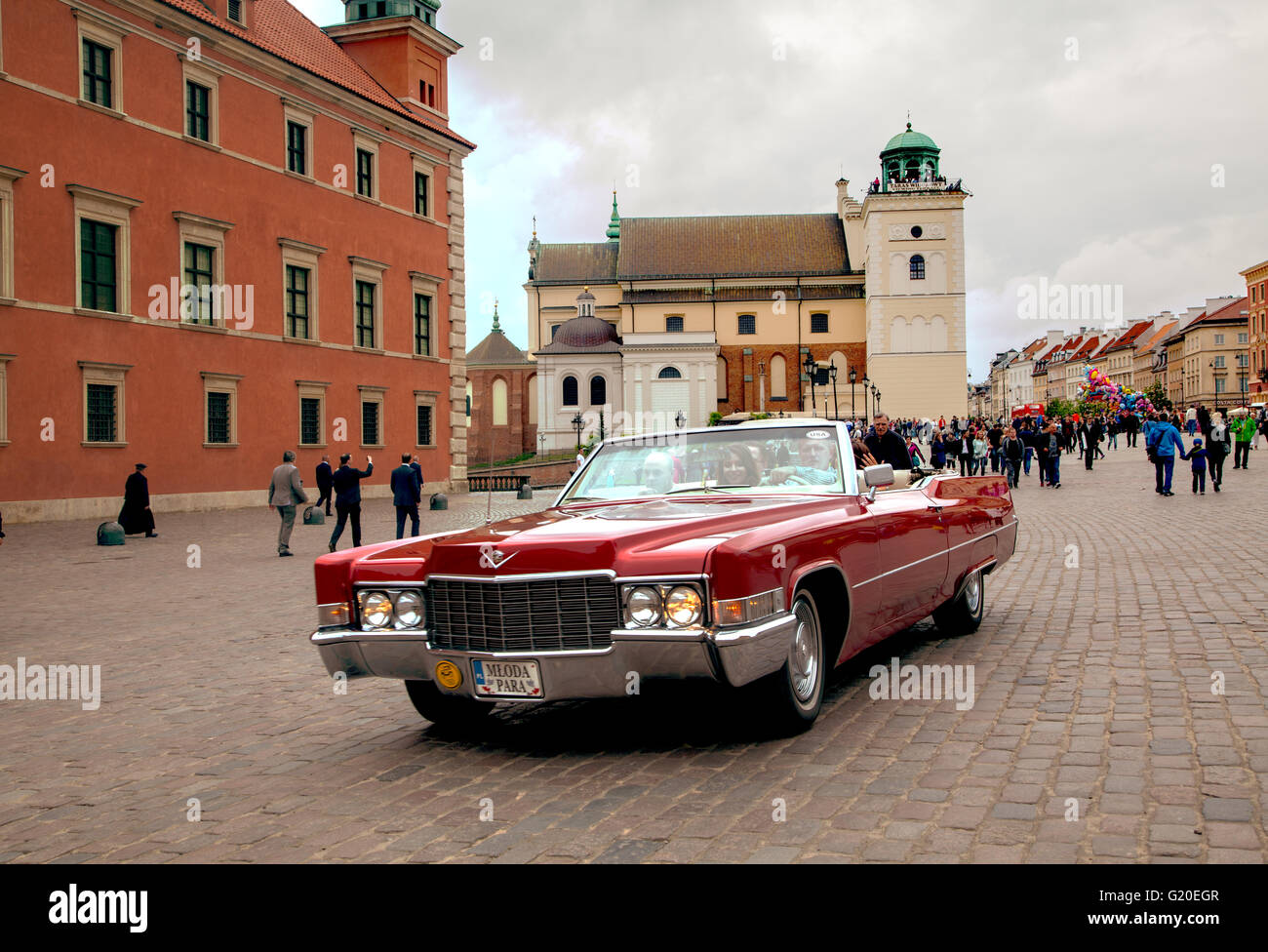 Classic car driving through Warsaw city center Poland Stock Photo Alamy