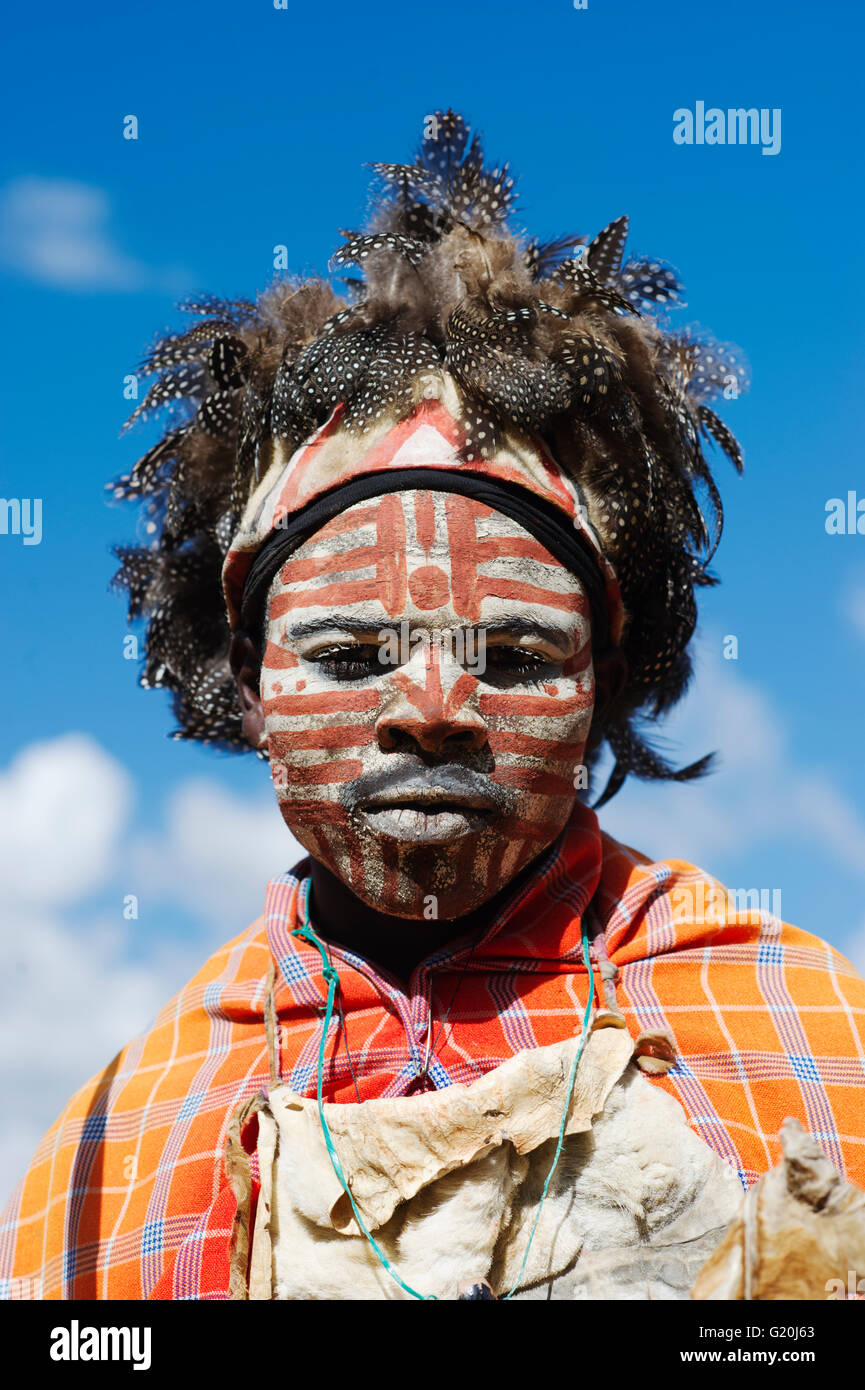 Kikuyu warrior wearing headress made of Helmeted Guineafowl feathers Tomson Falls Kenya Stock Photo