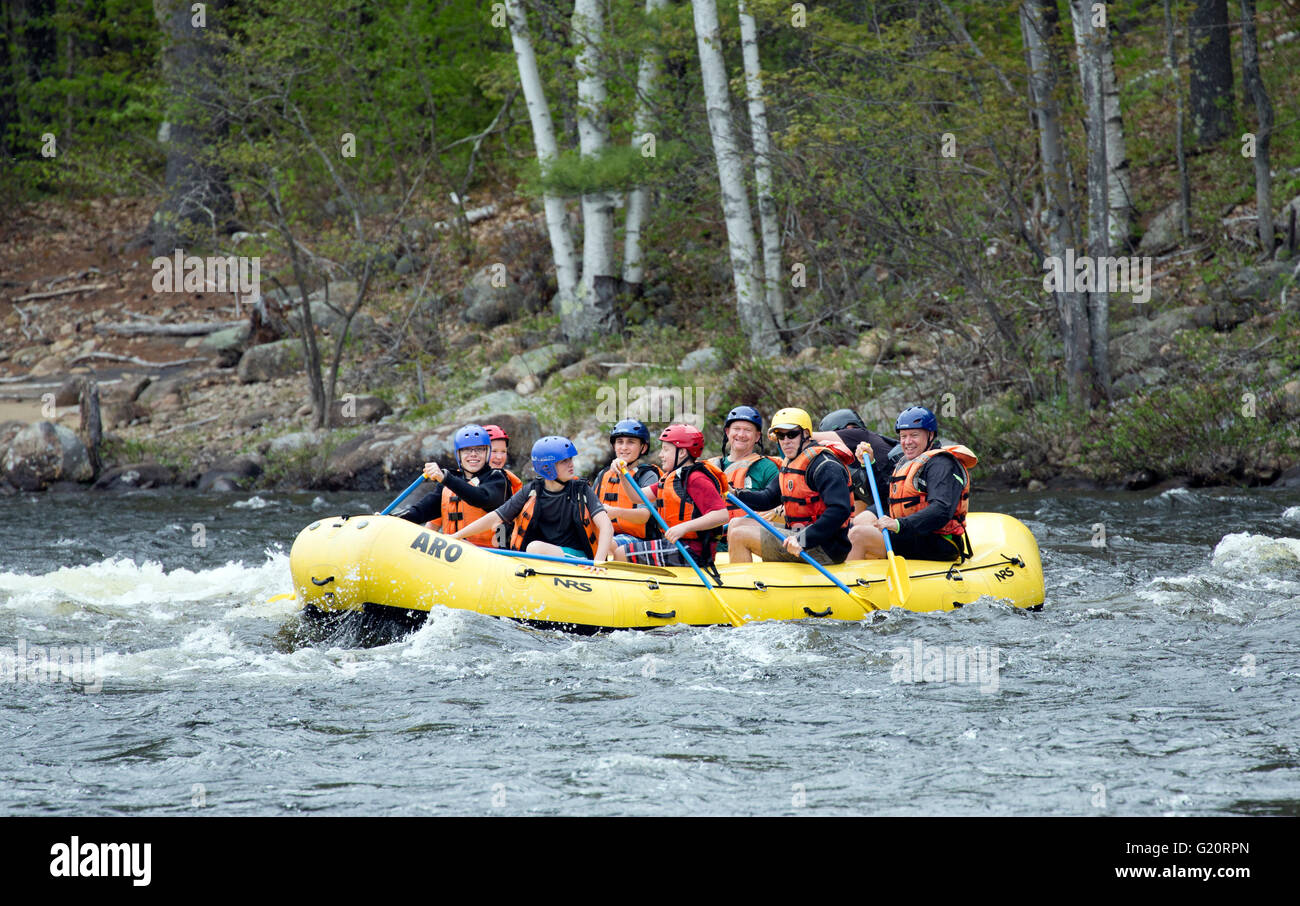 Family and friends on a river rafting trip. Stock Photo