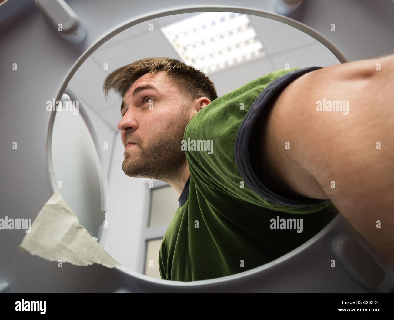 Man with hand in the toilet Stock Photo Alamy