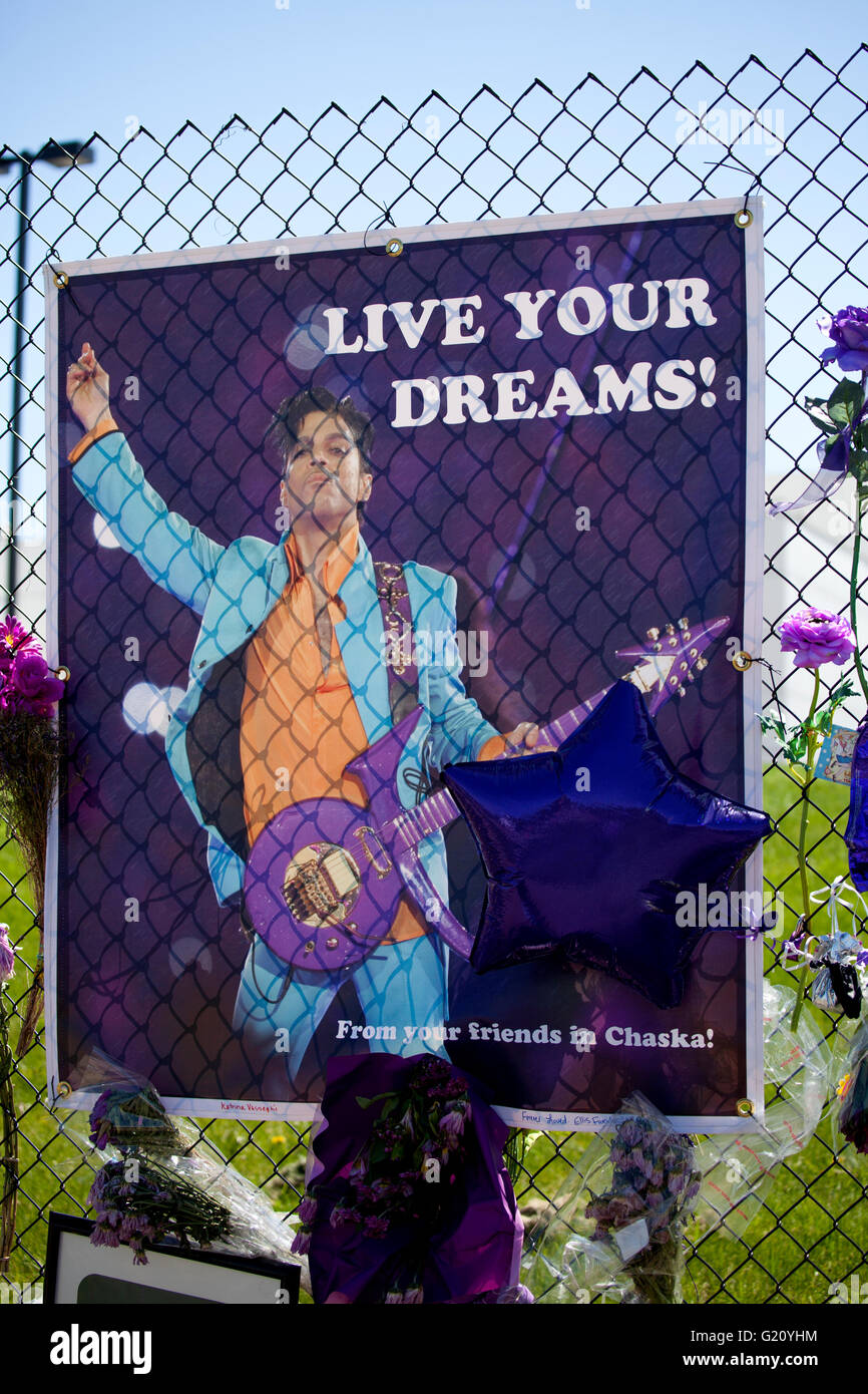 Prince playing his Love Symbol guitar on a Live Your Dream graphic. Paisley Park Studios Chanhassen Minnesota MN USA Stock Photo