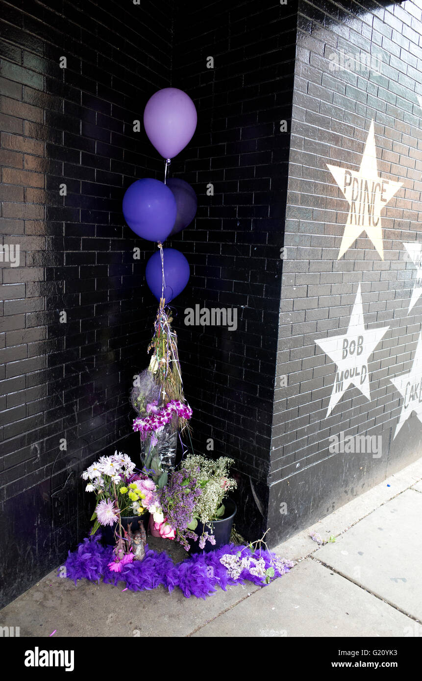 Star, memorial bouquets and balloons honoring Prince's life and music. First Avenue Nightclub Minneapolis Minnesota MN USA Stock Photo