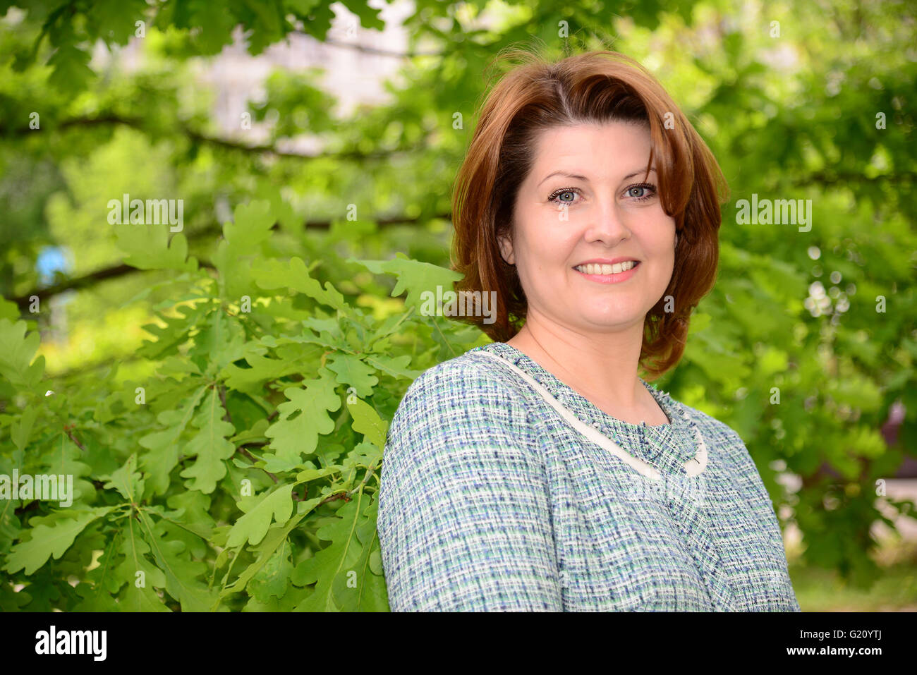 Woman portrait 40 smile hi-res stock photography and images - Alamy