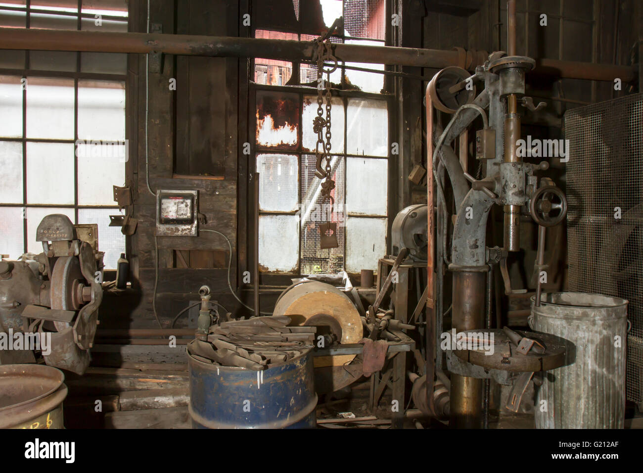 Rusing tools and equipmemt in vintage machinery shed. Stock Photo