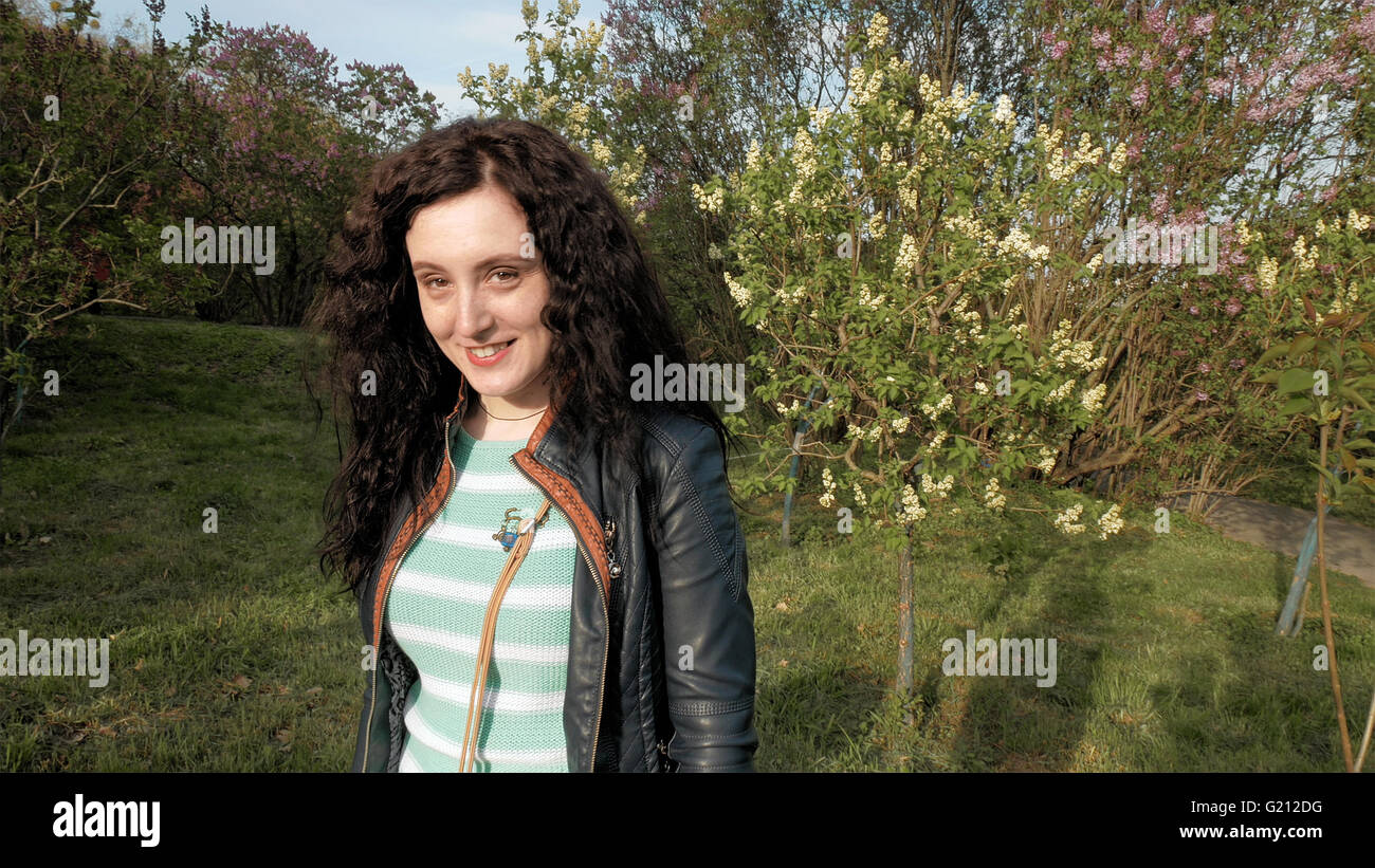 Pretty brunette long hair girl portrait outdoors Stock Photo - Alamy