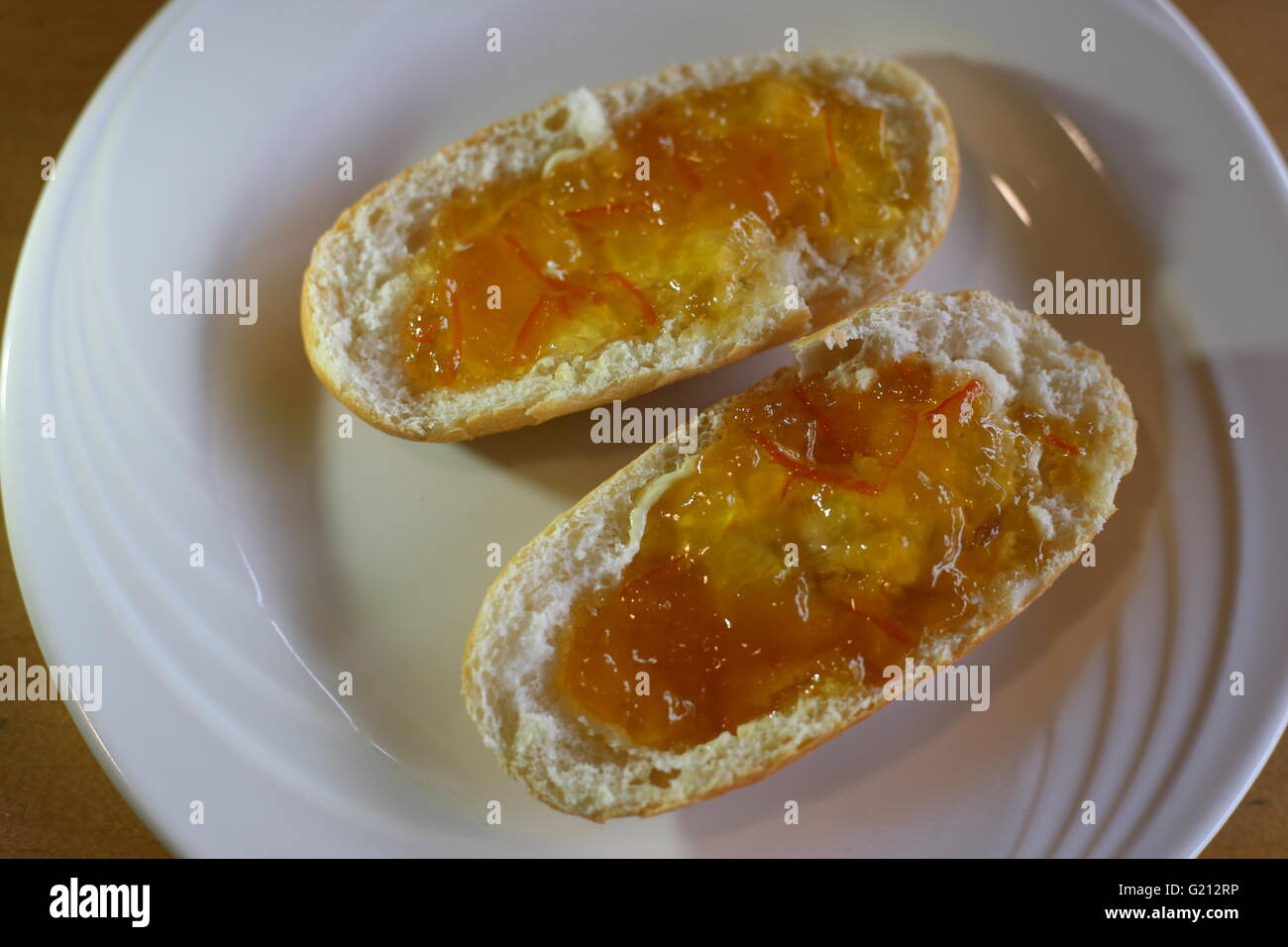 two buns with marmalade on a plate Stock Photo