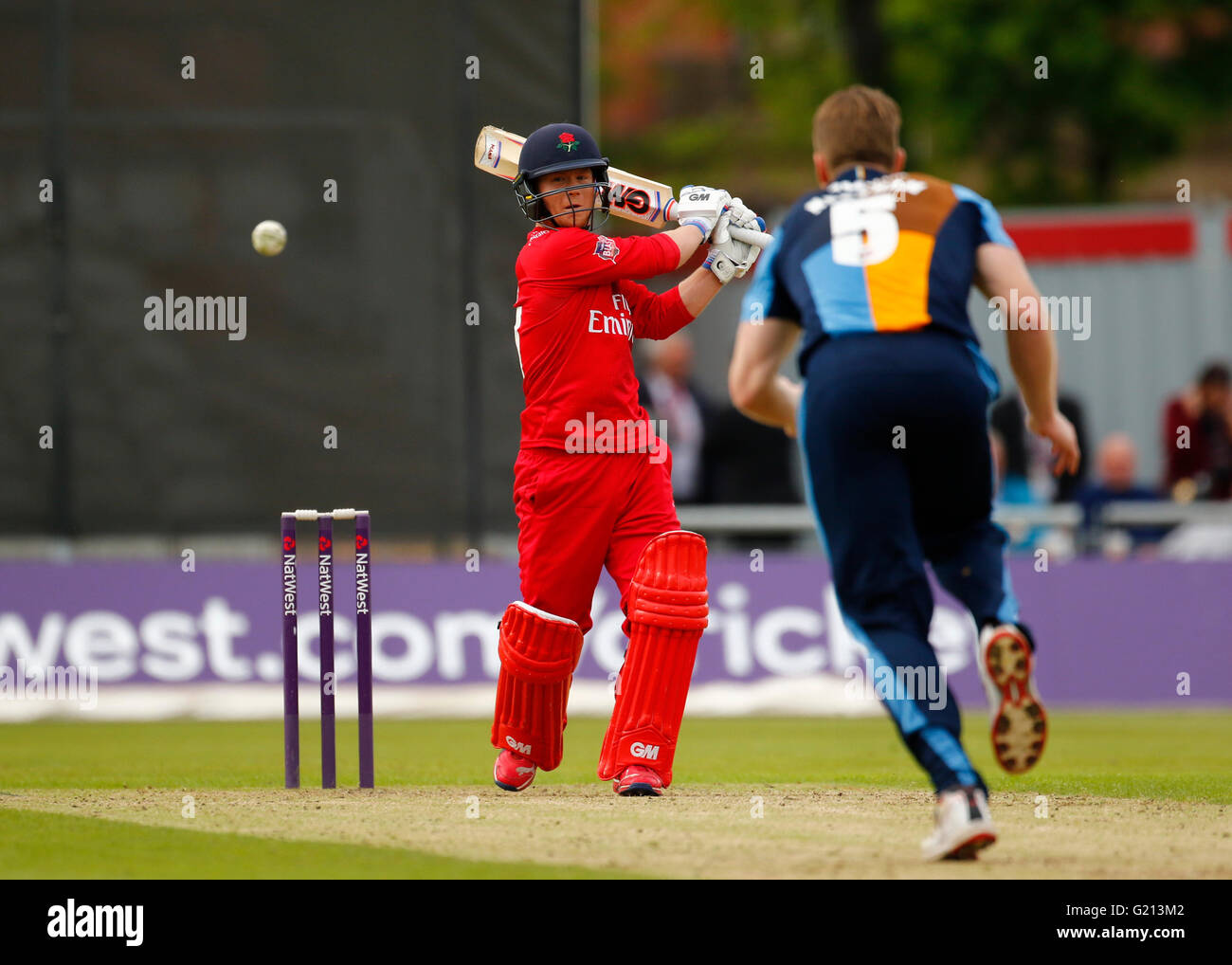 Old Trafford, Manchester, UK. 21st May, 2016. Natwest T20 Blast. Lancashire Lightning versus Derbyshire Falcons. Lancashire Lightning wicket keeper Alex Davies hits Derbyshire Falcons all-rounder James Neesham to the boundary. The New Zealand test player is making his T20 debut today, having signed up for the 2016 T20 Blast season.? Credit:  Action Plus Sports/Alamy Live News Stock Photo