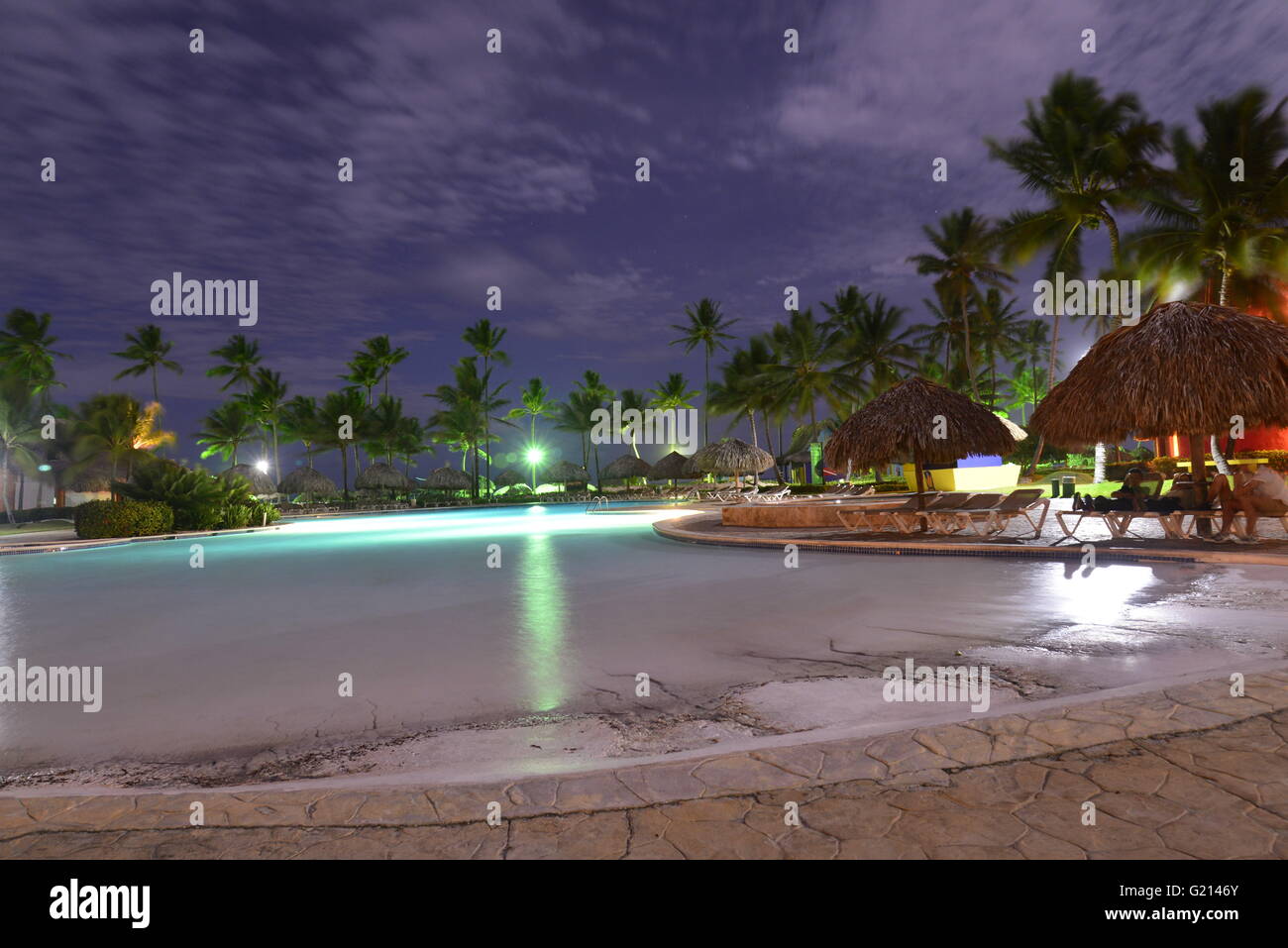 Swimming pool at Caribbean Princess Resorts & Spa at dusk, Punta Cana, Dominican Republic Stock Photo