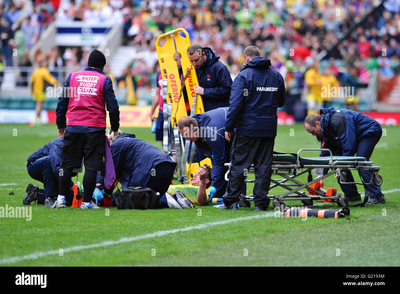 London, UK. 21st May, 2016. Medical personnel coming to the aid of Lucas Muller (BRA) who was left lying on the pitch in agony after an aggressive tackle in the pool match with Russia, HSBC World Rugby Sevens Series, Twickenham Stadium, London, UK. He was eventually stretchered off the pitch. Russia went on to win the match by 14-5. Credit:  Michael Preston/Alamy Live News Stock Photo