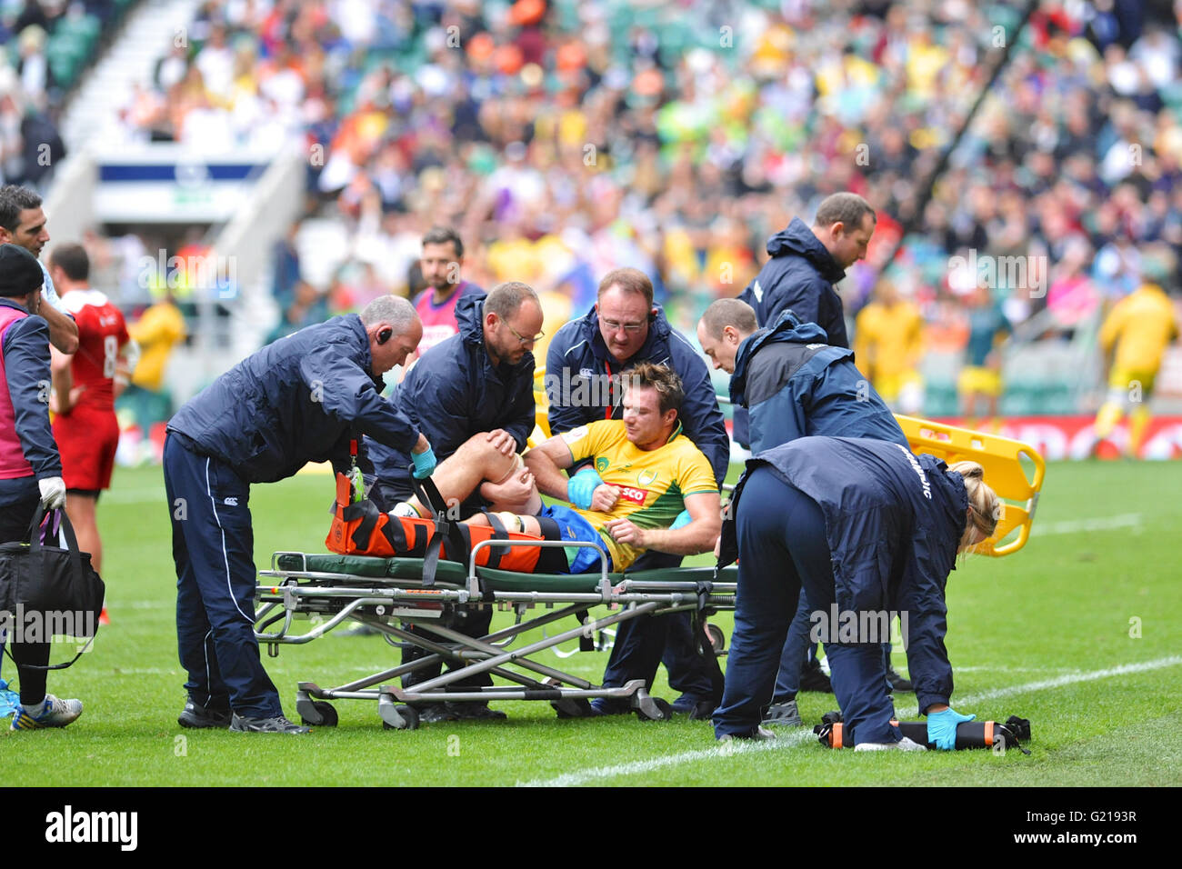 London, UK. 21st May, 2016. Medical personnel coming to the aid of Lucas Muller (BRA) who was left lying on the pitch in agony after an aggressive tackle in the pool match with Russia, HSBC World Rugby Sevens Series, Twickenham Stadium, London, UK. He was eventually stretchered off the pitch. Russia went on to win the match by 14-5. Credit:  Michael Preston/Alamy Live News Stock Photo