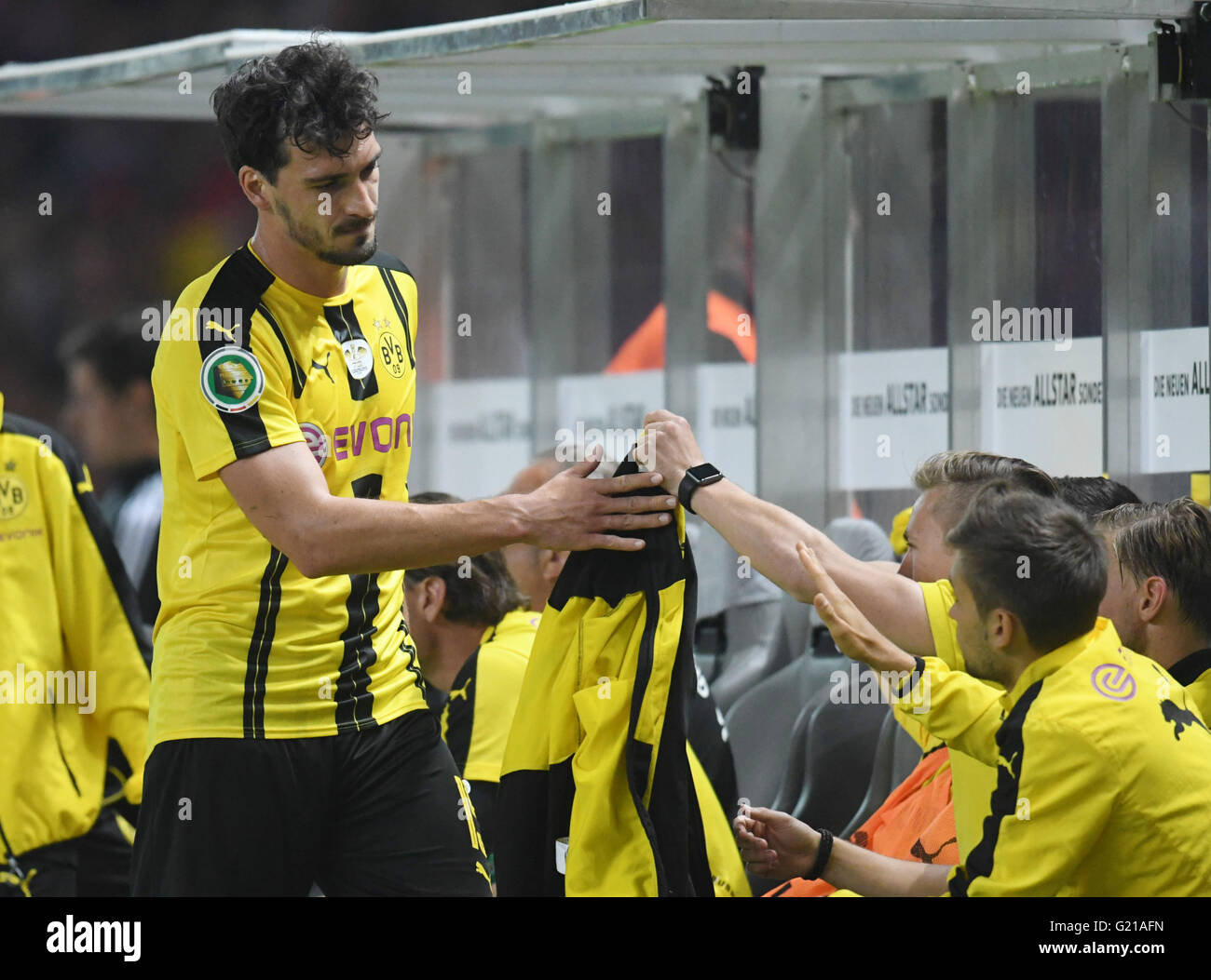 Berlin, Germany. 21st May, 2016. Dortmund's Mats Hummels (L) walks off