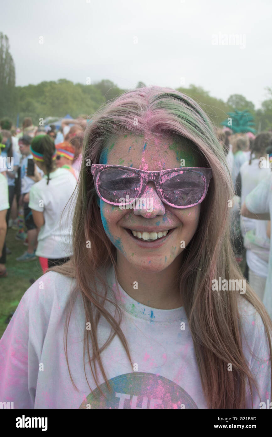 Girl with sun glasses covered in paint dust at the Color Run Stock Photo -  Alamy