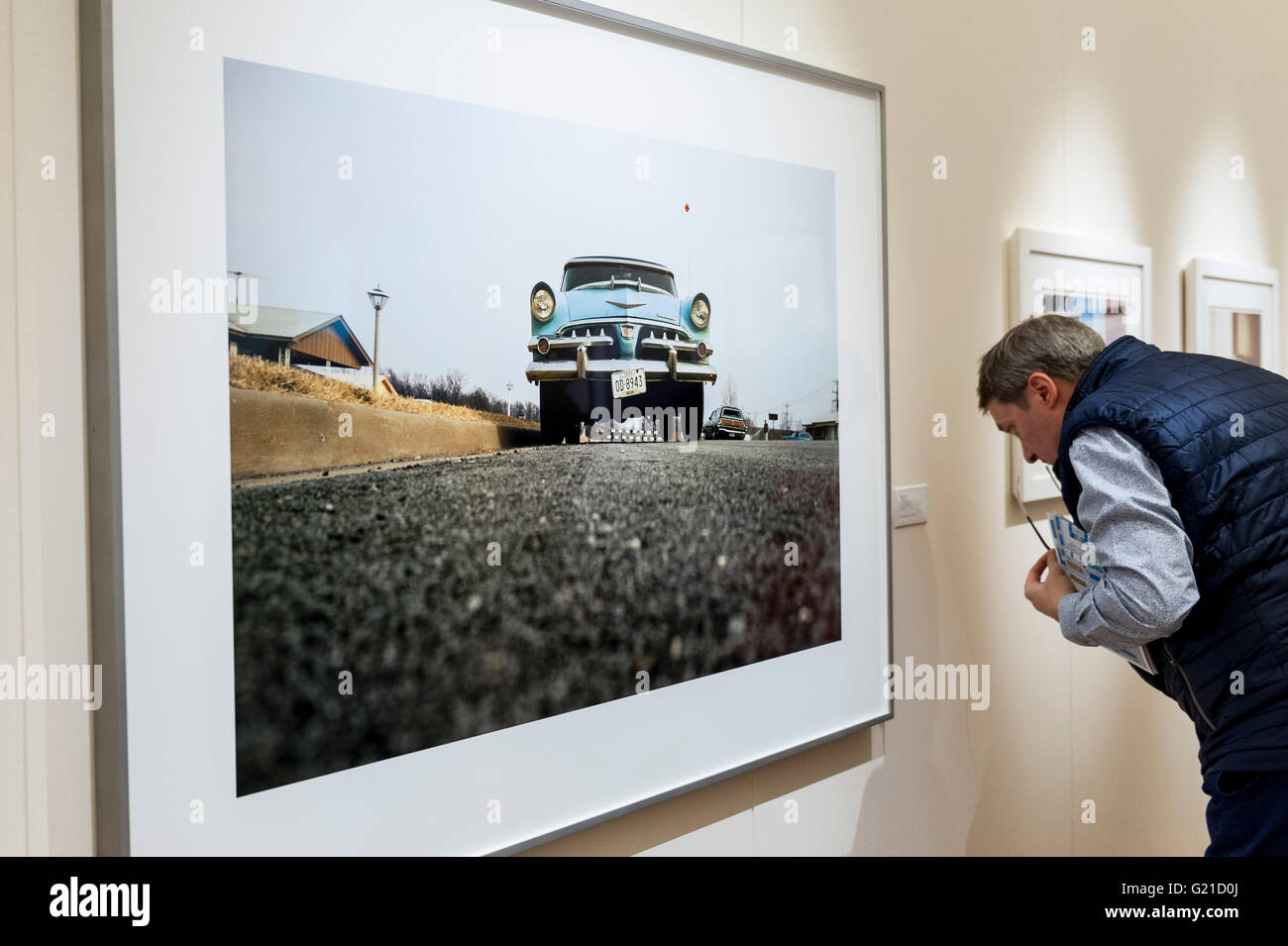 London, UK. 22 May 2016. A visitor looks at 'Untitled' by William Eggleston. The final day of Photo London, a four day photography fair, takes place at Somerset House. Large numbers of photography collectors and enthusiasts visit to see works by internationally renowned photographers presented by 85 galleries. Credit:  Stephen Chung/Alamy Live News Stock Photo