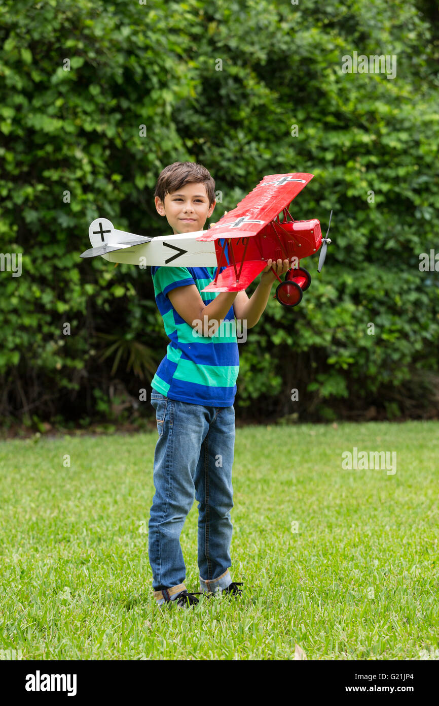 Male Child Playing with model airplane Stock Photo