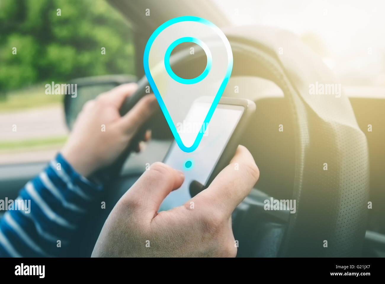 Female driving car and using gps navigation app on smartphone to find destination, using mobile