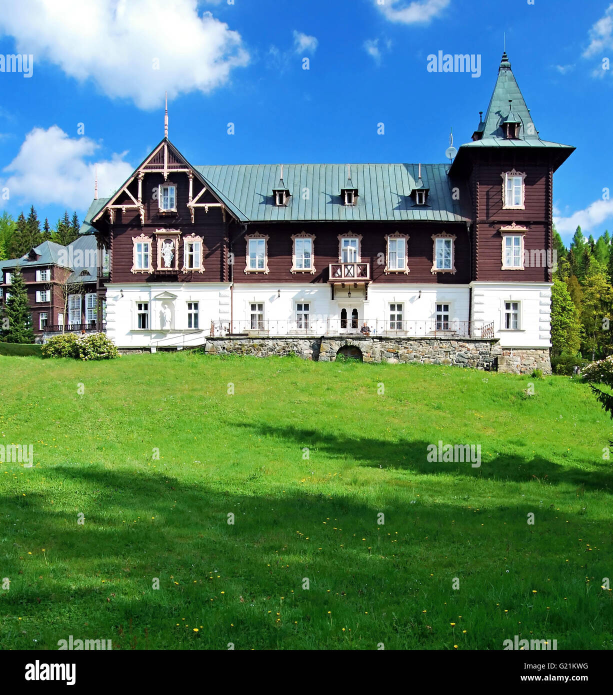 wooden spa buildings in Karlova Studanka health spa in Jeseniky mountains during nice spring day Stock Photo