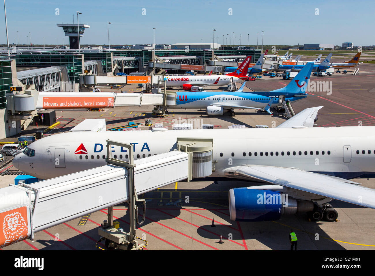 Amsterdam Schiphol, international airport, planes at the gates, terminal building, taxiway, taking off, internatinal airlines Stock Photo