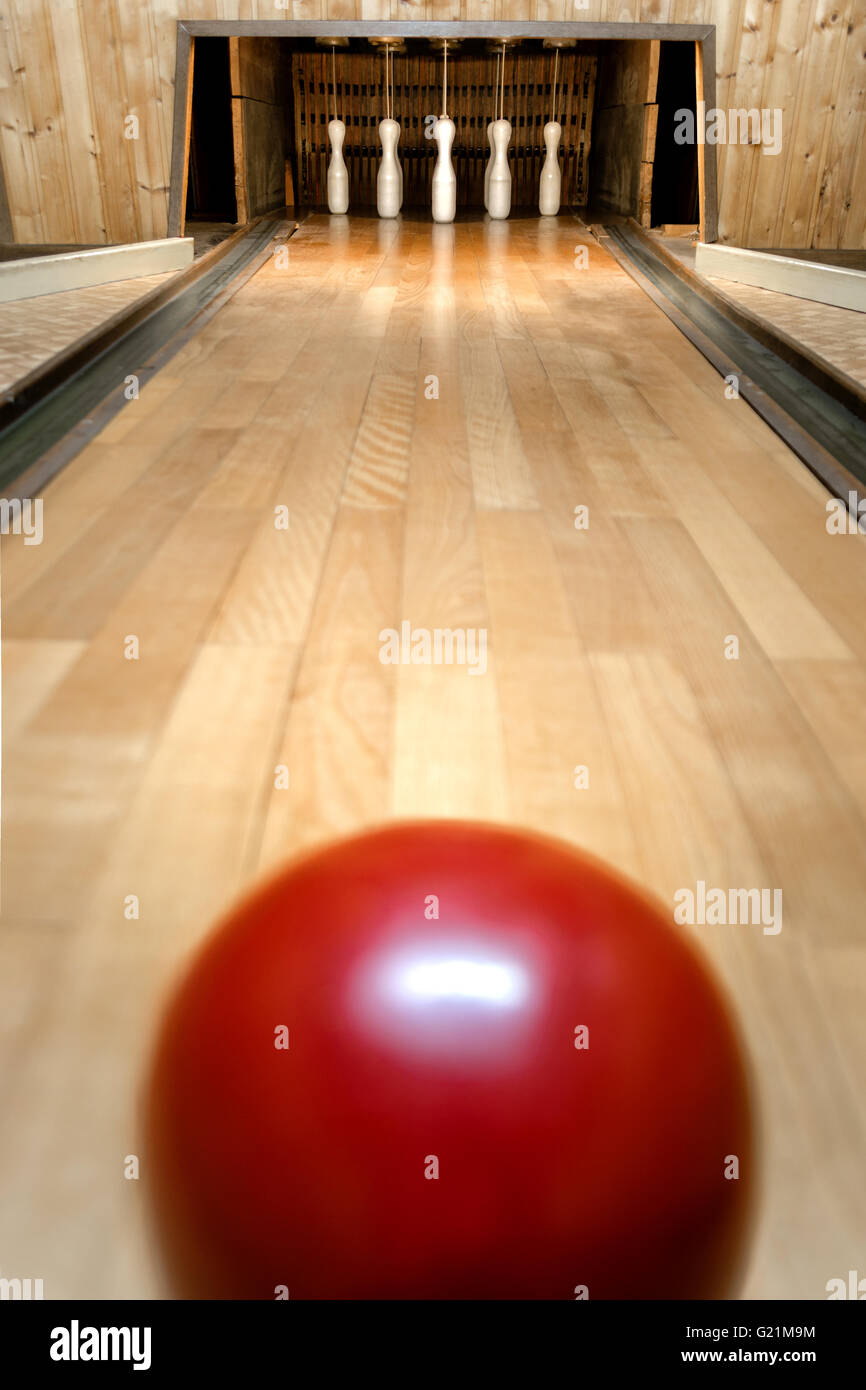 bowling alley with a red ball in germany Stock Photo Alamy