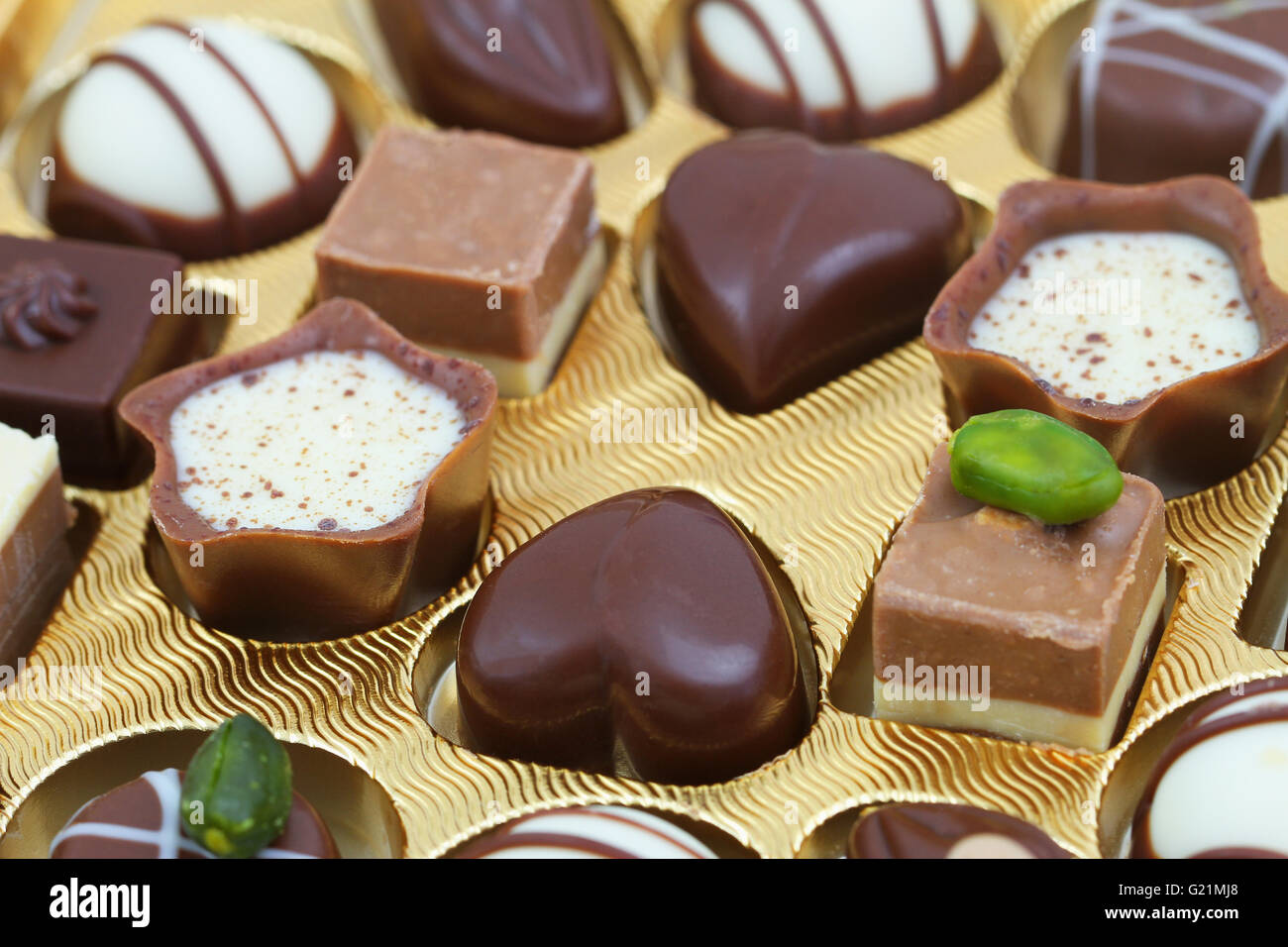 Assorted white and milk chocolates, closeup Stock Photo