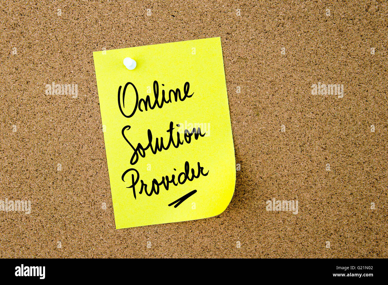 Online Solution Provider written on yellow paper note pinned on cork board with white thumbtack, copy space available Stock Photo