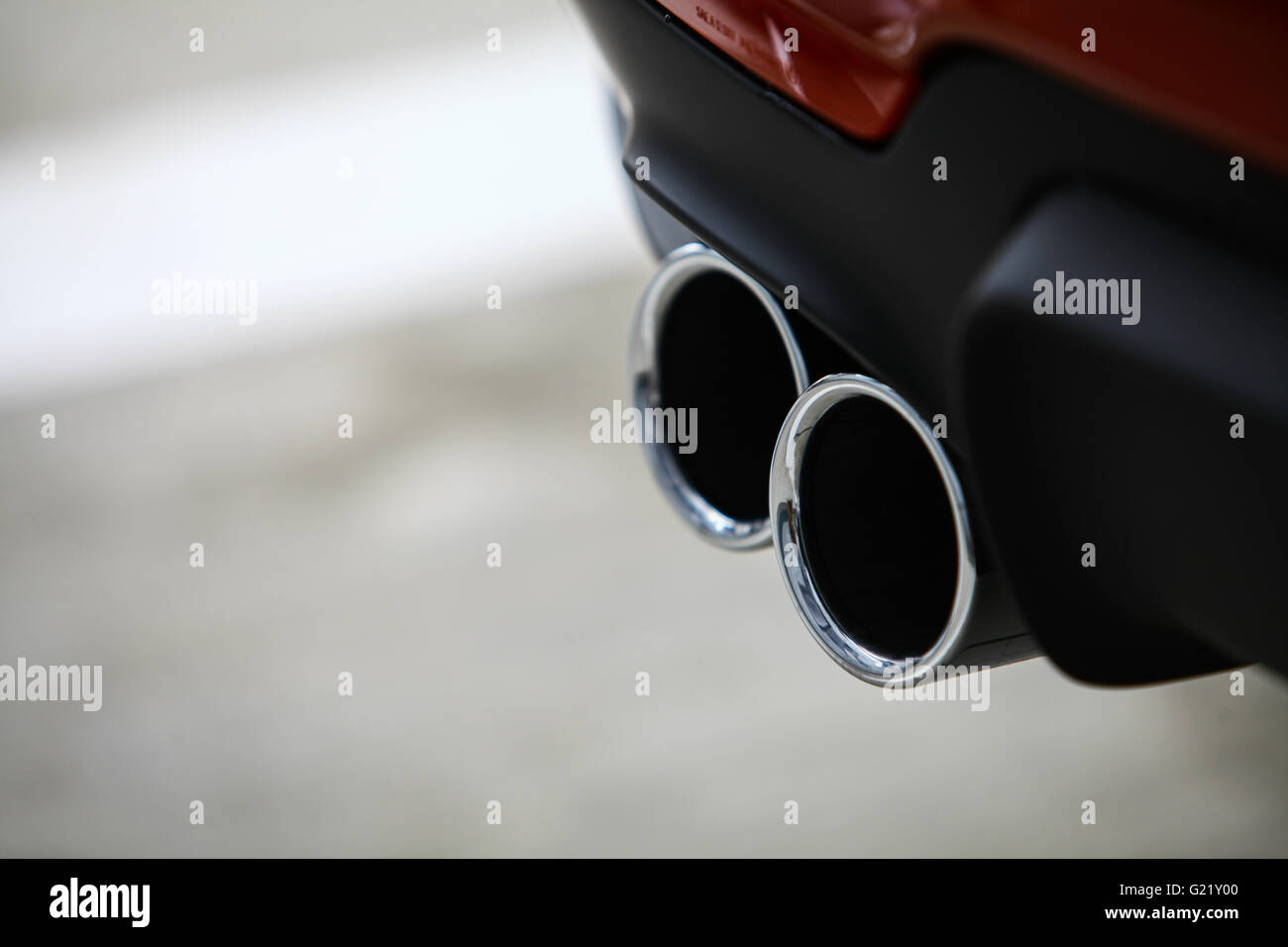 Detail of the double exhaust of a car Stock Photo Alamy