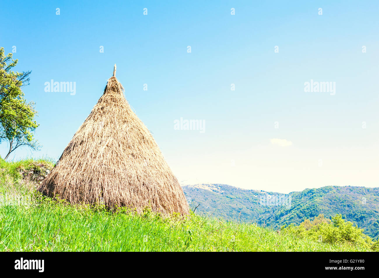 Traditional haystack of mountain villages in Italian Alps. Stock Photo