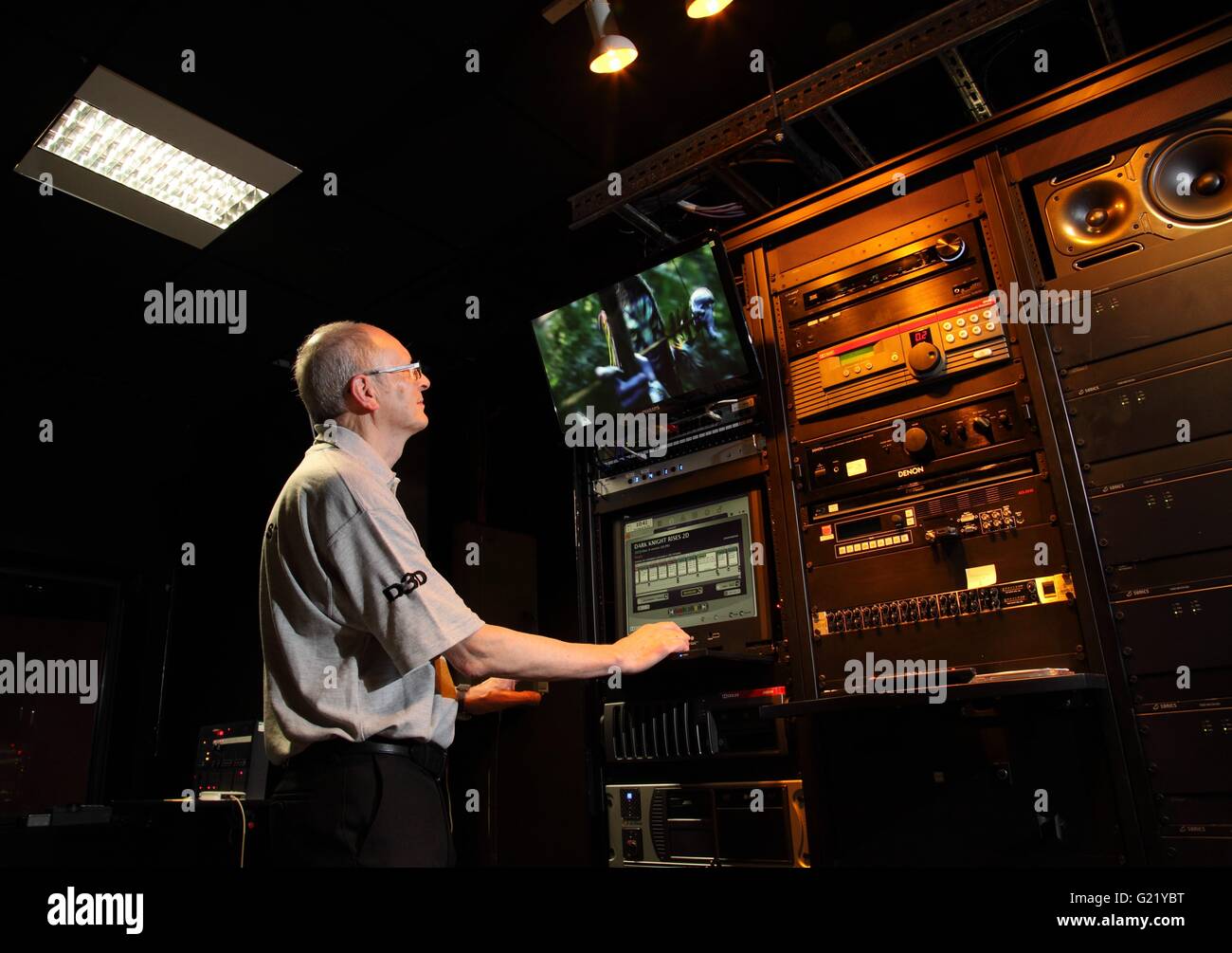 A man at the controls of a Giant Screen Cinema in Millennium Point, Birmingham Stock Photo