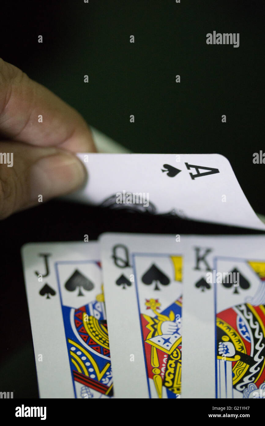 Ace of spades completes a winning hand in a card game Stock Photo Alamy