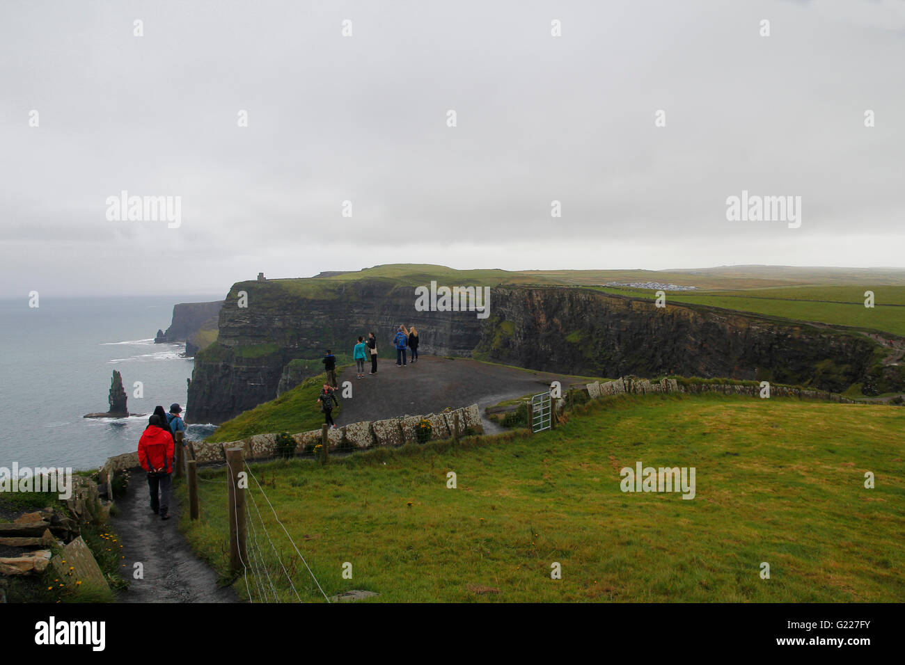 People walking in Cliffs of moher in Clare co., Ireland Stock Photo