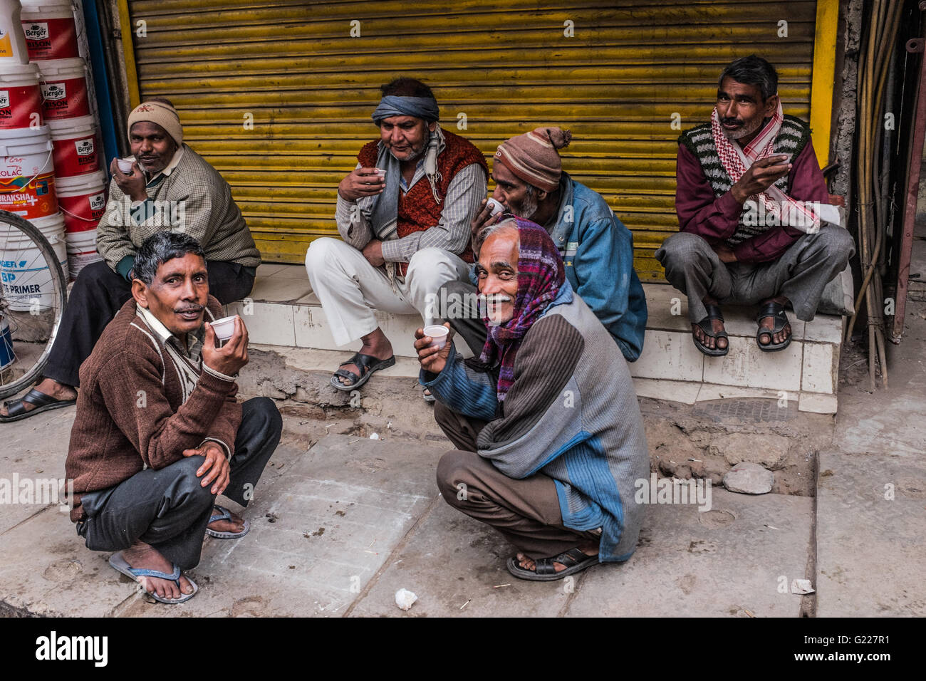 Old men sat around drinking chai, Delhi, India. Stock Photo