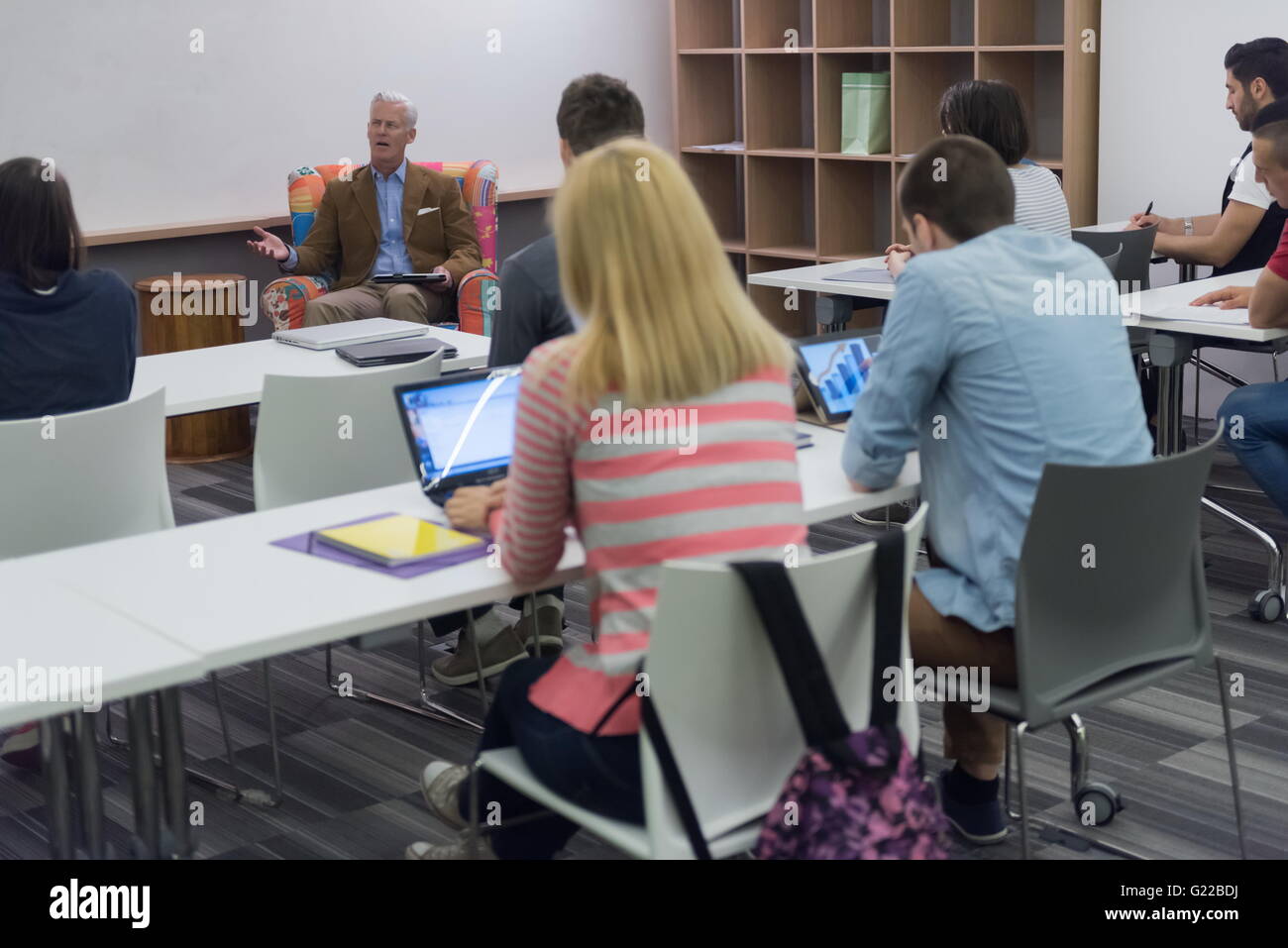 group of students study with professor in modern school classroom Stock ...