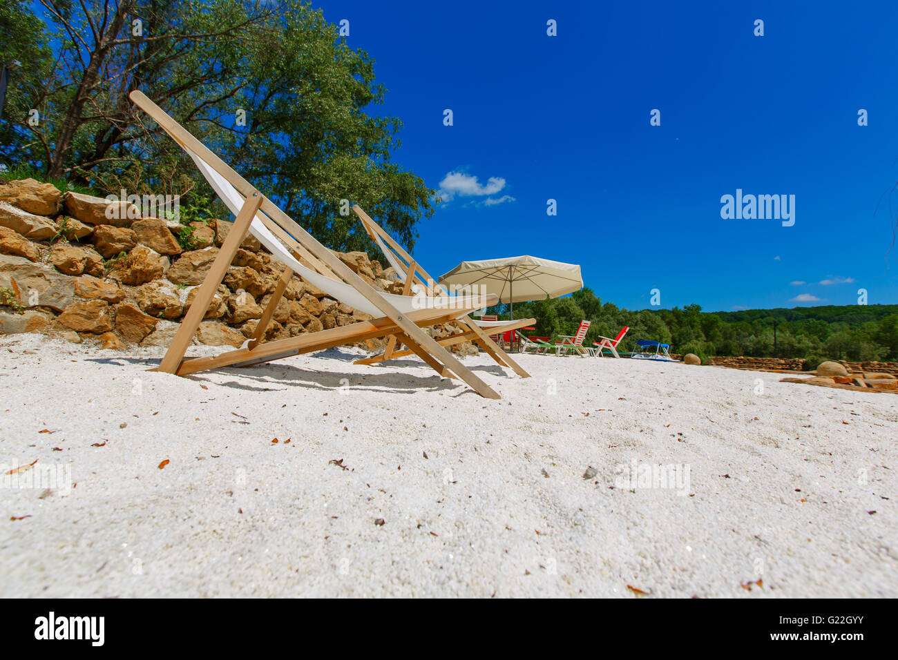 Two deck chairs umbrella hi-res stock photography and images - Alamy