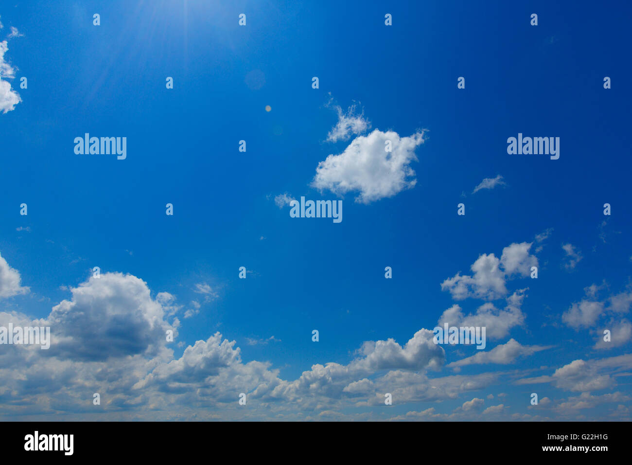 blue sky with clouds on a sunny summer day Stock Photo - Alamy