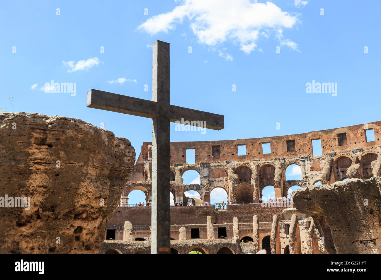 Christian cross in the Colosseum, Rome, spectacular ruins from the days