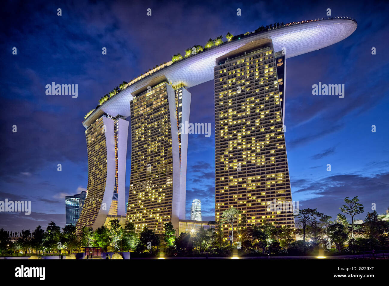 Exterior evening view of Marina Bay Sands from Gardens by the Bay, Marina Bay, Singapore on July 22, 2012. Stock Photo